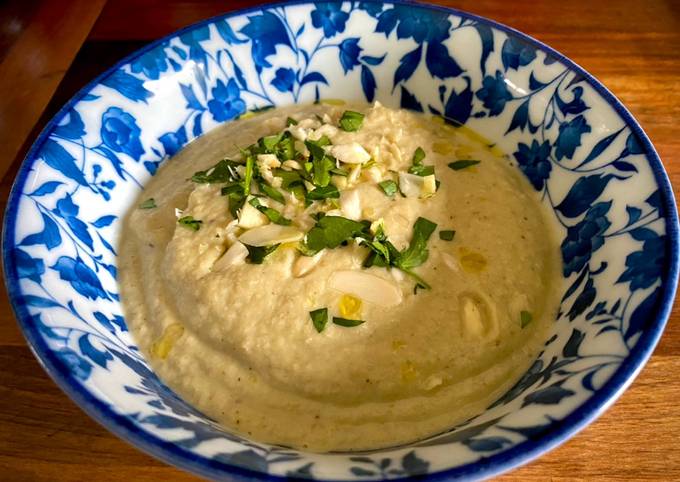 A picture of Almendras Soup with spiced almonds and cauliflower.