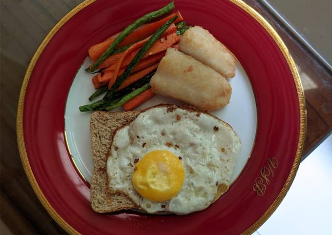 A picture of Pan Fried Dory with Vegetable Fries and Egg Toast.