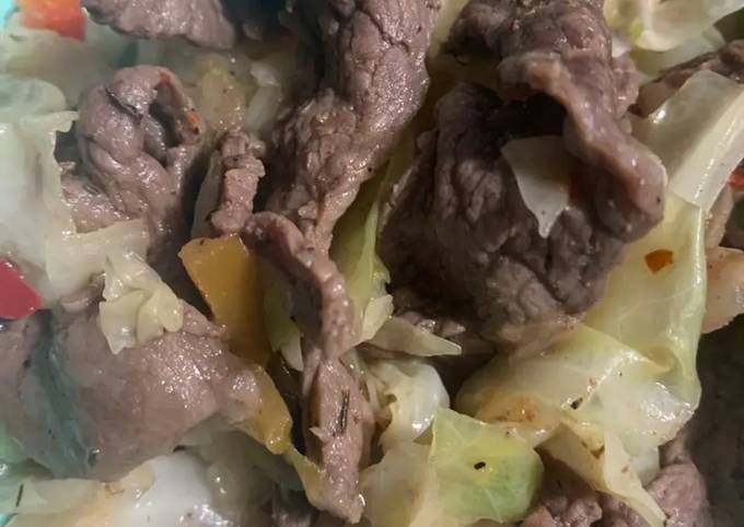 A picture of Seductive Sizzle Beef with Caramelized Cabbage and Peppers.