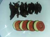 A picture of Grilled fillet strips with tomato and cucumber.