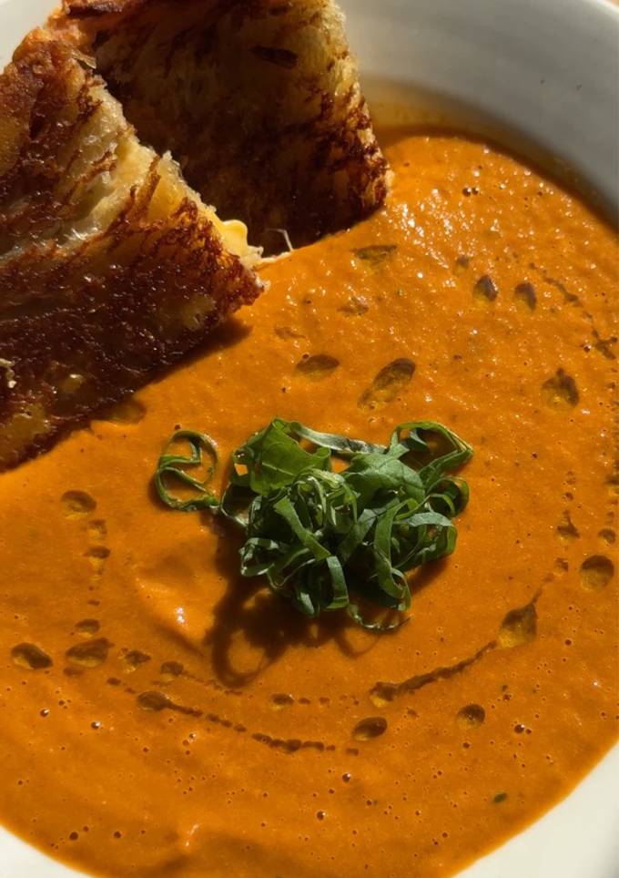 A picture of Roasted Tomato Soup + Grilled Cheese.