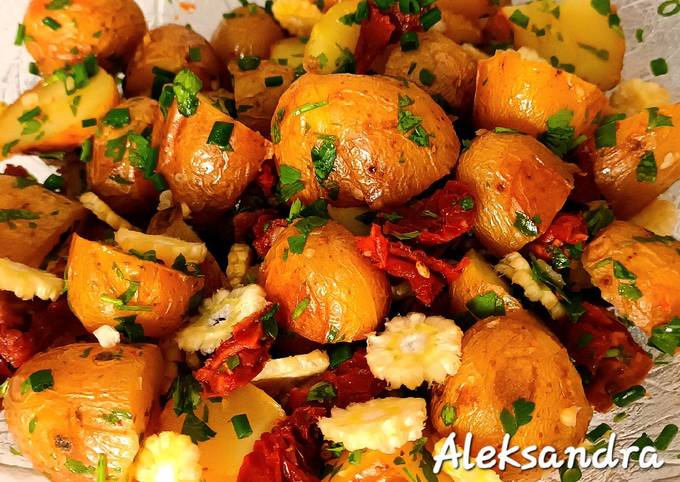 A picture of Warm potato salad with sundried tomatoes.