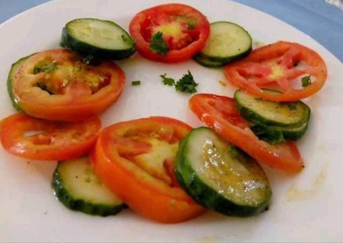 A picture of Tomato 🍅 Cucumber 🥒 Salad.