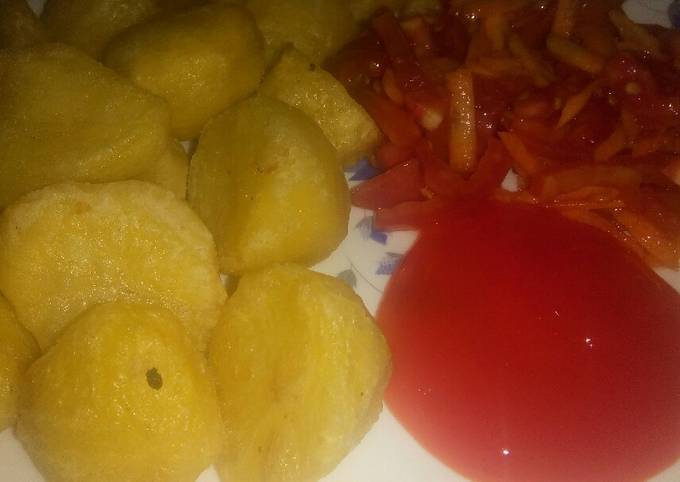 A picture of Fried potatoes with carrot and tomato salad #allstarcontest.