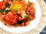 A picture of Fried Eggs with Bacon, Kale and Tomatoes.