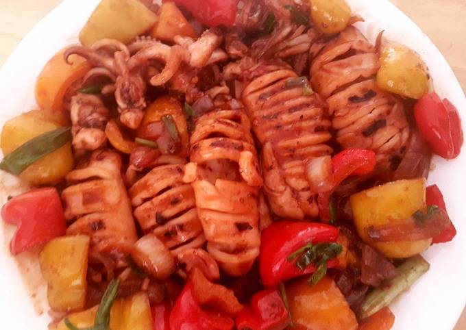 A picture of Grilled squid and stir fry vegetables.