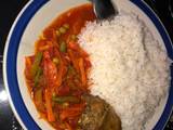 A picture of White rice and vegetable sauce.