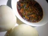 A picture of Pounded yam and vegetable soup.