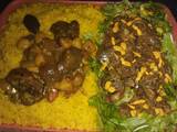 A picture of Turmeric rice with vegetable soup and salad.