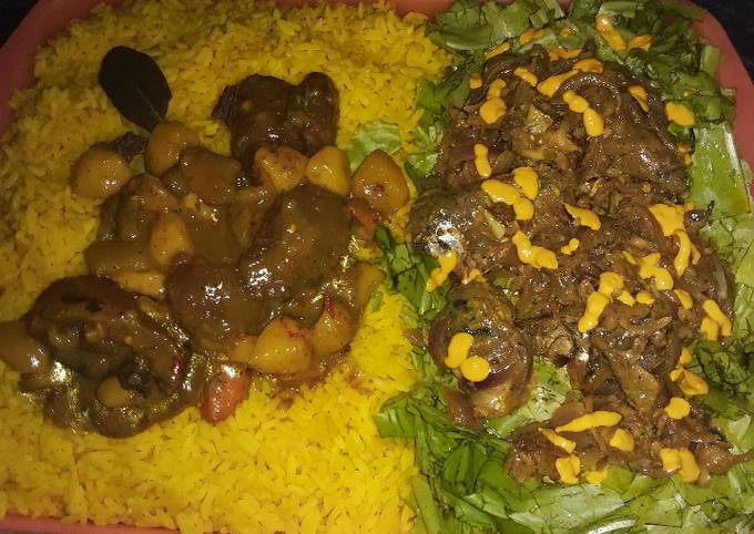 A picture of Turmeric rice with vegetable soup and salad.