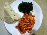 A picture of Ugali,fried sukuma (kales) and eggs.