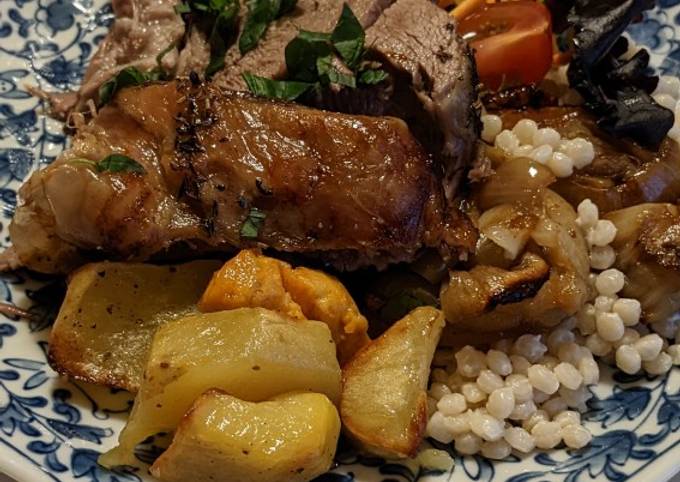 A picture of Roasted Lamb shoulder with giant Couscous & caramelised onions.