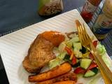 A picture of Roasted chicken,baked carrots and green salad.