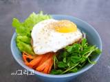 A picture of Bibimbap (Korean Rice Bowl with Beef and Vegetables).