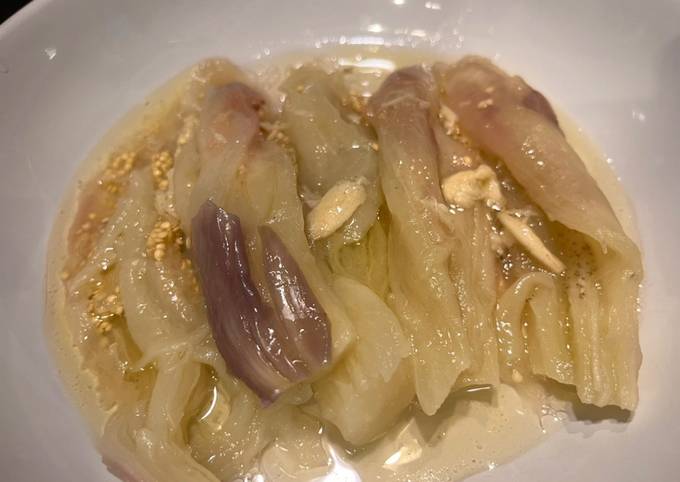 A picture of Steamed aubergine with lemon, olive oil and garlic.