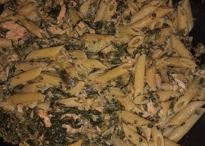 A picture of Penne with salmon spinach and courgette.