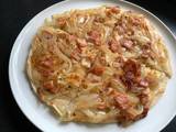 A picture of Pan Fried Onion Bacon Cheese Flatbread.