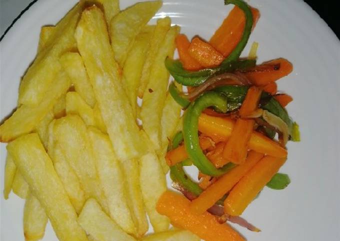 A picture of Fries and stir fry veges.