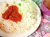 A picture of Sphagetti and vegetables with spiced tea.