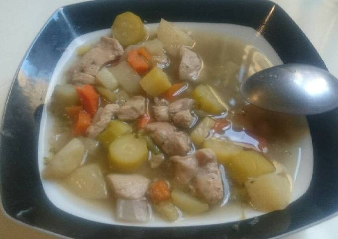 A picture of Vegetables and chicken soup.