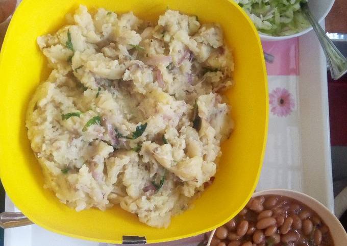 A picture of Mashed potatoes, beans & steamed cabbage dinner.