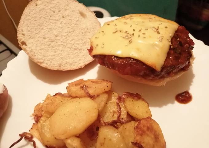 A picture of Burgers patties in spicy tomato sauce.