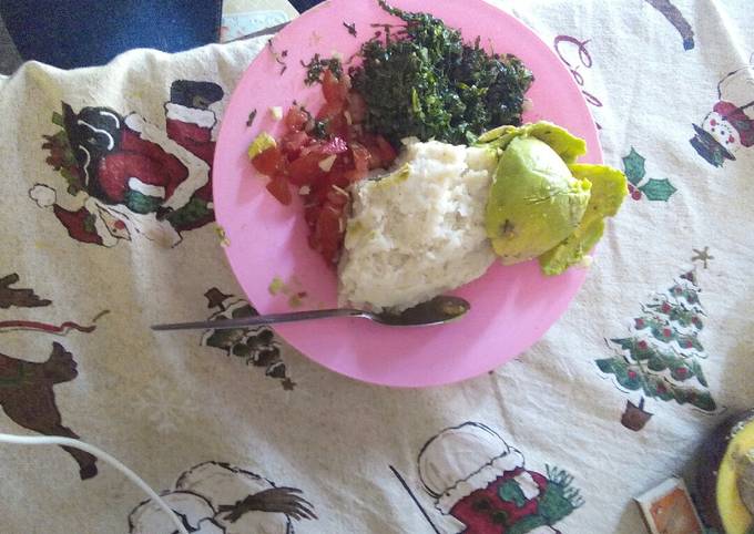 A picture of Fried kales,ugali plus kachumbari.