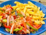 A picture of Sweet potatoe chips and vegetables stir fry.