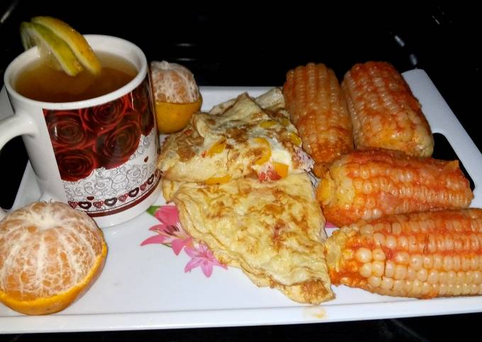 A picture of Boiled maize in tomatoes.