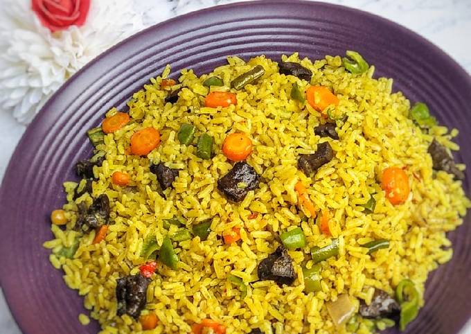 A picture of Rice with vegetables.