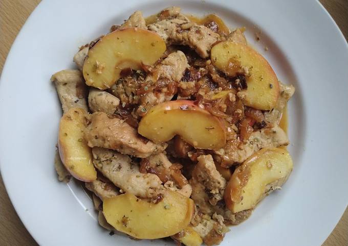 A picture of Pork with apple and onion.