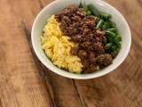 A picture of 🍚 Tricolor Donburi - Japanese bowl of rice with minced meat, eggs and green vegetable.