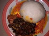 A picture of Pounded yam and vegetable soup.