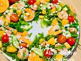 A picture of Salad "Wreath" of spinach with shrimps and tangerine.