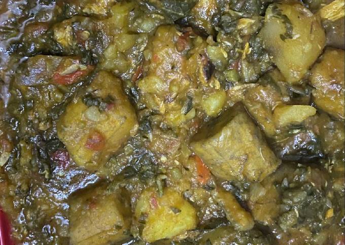 A picture of Potatoes and plantain porridge with vegetable.