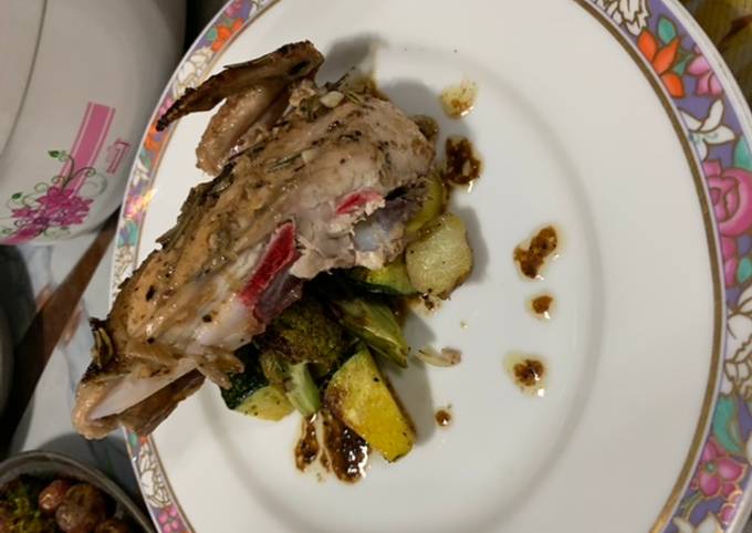 A picture of Green herbed grilled chicken with oven roasted vegetables.