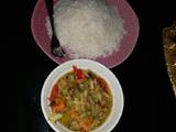 A picture of White rice n chicken veg soup.