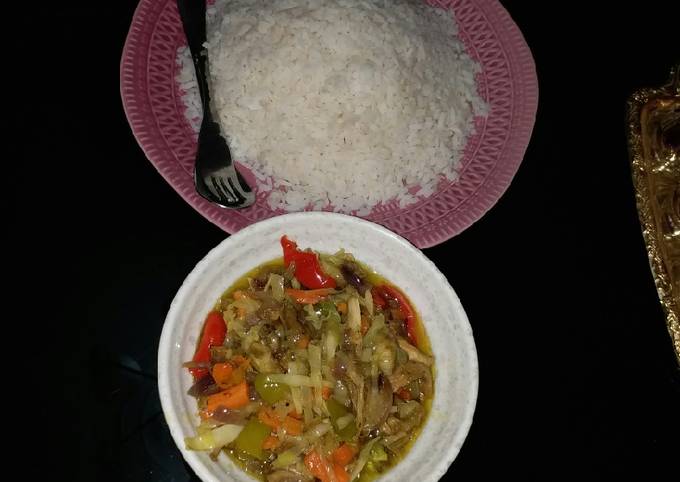 A picture of White rice n chicken veg soup.