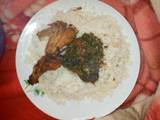 A picture of White rice with vegetable soup nd fried chicken.