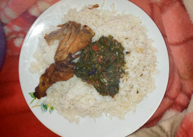 A picture of White rice with vegetable soup nd fried chicken.