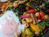 A picture of One-pan egg, tomato, chard + cumin brunch.