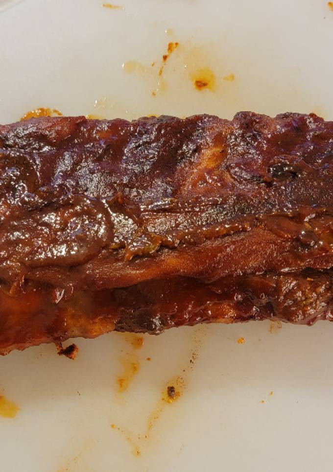 A picture of Oven backed Rib rack w/ homemade sauce and rub.