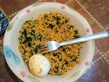 A picture of Indomie, egg and vegetable (ugu).