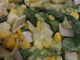 A picture of Healthy salad with spring onions, sweetcorn, avocado, baby spinach and little gem lettuce.