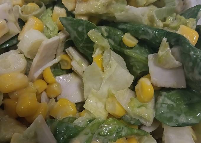 A picture of Healthy salad with spring onions, sweetcorn, avocado, baby spinach and little gem lettuce.