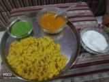 A picture of Vegetable khichdi with dahi launji and chutney.