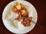 A picture of Rice with bean stew,cabbage and Irish potatoes.