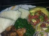 A picture of Goat roasted meat, greens and lettuce kachumbari.