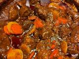 A picture of Beef stew in a Dutch Oven.