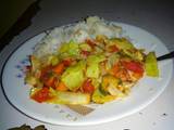 A picture of Rice with stir fry vegetables.